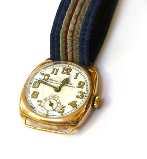 A Gentleman's 9ct gold cased wrist watch on dial Herbert Wolf London Liverpool Manchester, gold