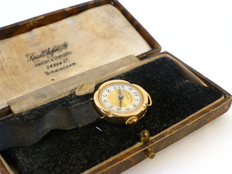 A lady's 9ct gold cased wristwatch retailed by Sir John Bennett Ltd London, having black Arabic