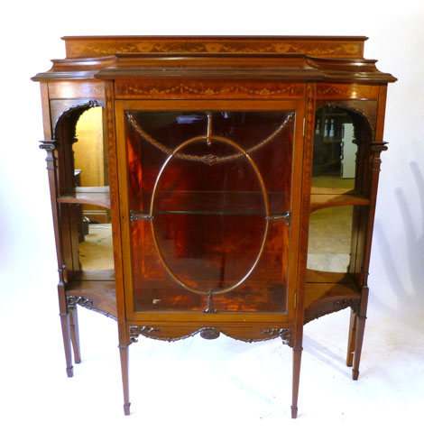 An Edwardian inlaid mahogany display cabinet with galleried top over an astragal glazed centre