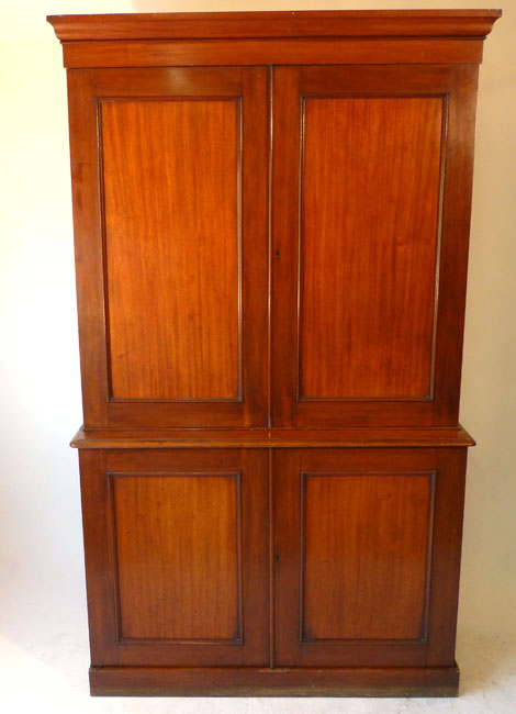 A Victorian mahogany ship's cabinet chiffonier, the panelled doors revealing a fitted interior