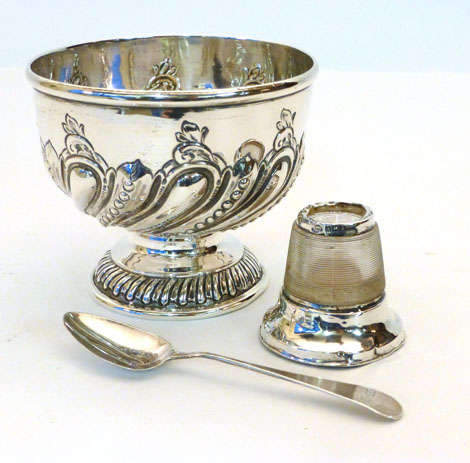 An Edwardian silver bowl raised on a pedestal foot with chased demi gadrooned decoration and blank