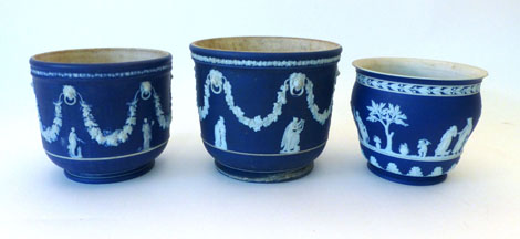 A Wedgwood dark blue Jasper ware jardiniere, typically decorated with classical figures, h20cm