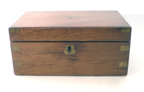 A Victorian mahogany writing slope of rectangular form with brass mounts and fitted interior