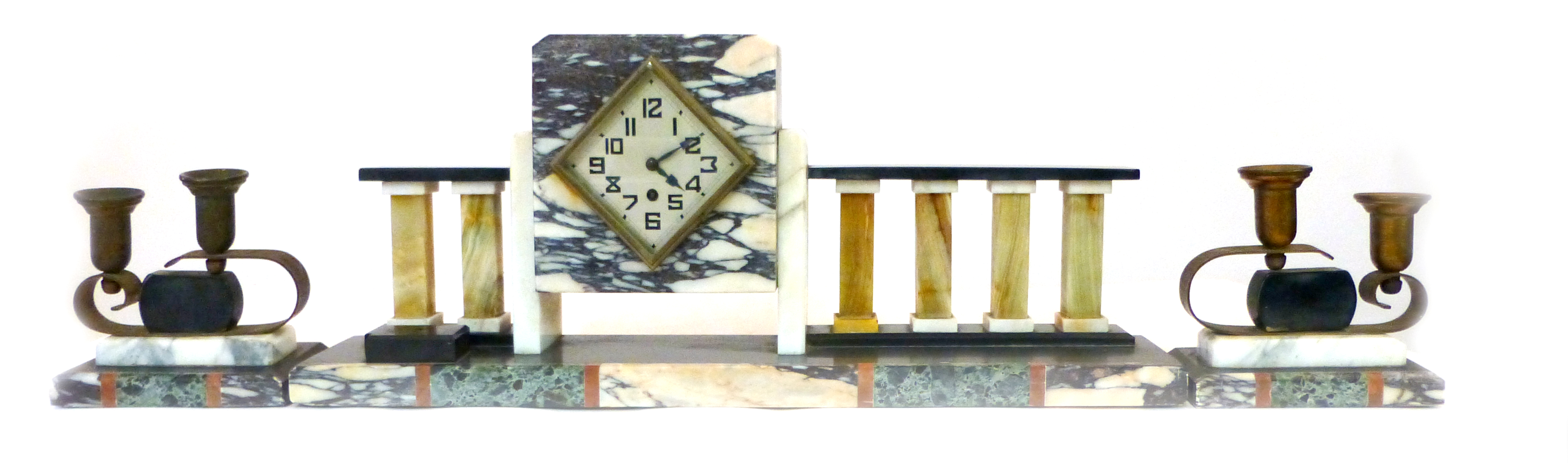 An Art Deco slate and marble clock garniture, the square clock mounted on a slate and onyx railing