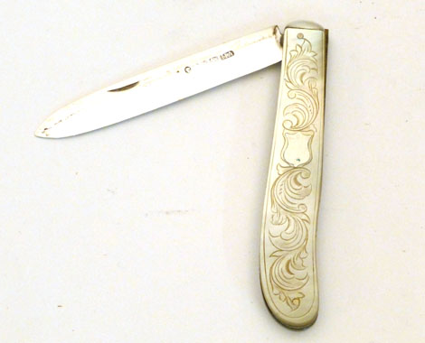 A Victorian mother of pearl folding fruit knife with silver mounts and blade, Atkin Bros, date