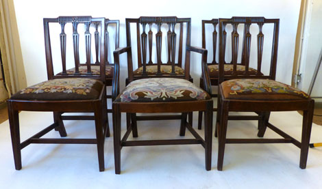 Six (1+5) early 19th century mahogany dining chairs with fluted splats and rectangular back rests,