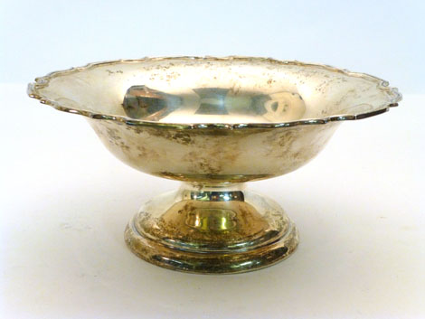 A George V silver piecrust edge footed bowl of circular form raised on a domed circular foot, Walker