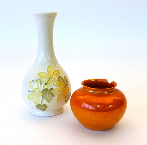 A Moorcroft vase of baluster form tube lined with yellow flowers on a cream ground, impressed