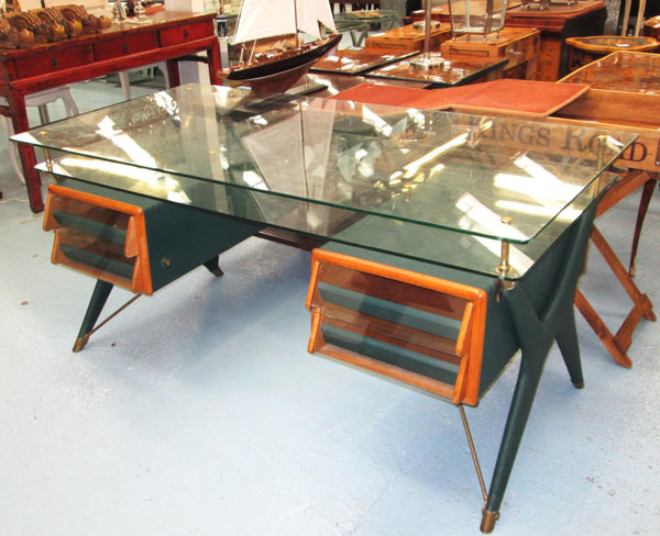 PARTNERS DESK, Italian style, with a glass top and a glass undershelf having four drawers below on