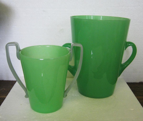 TWO BOTTLE COOLERS, early 20th century green vaseline glass, both with two handles, 30cm and 23cm H.