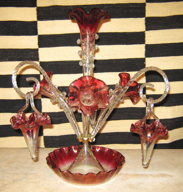 GLASS EPERGNE, Victorian cranberry glass of three candy canes with three baskets, 49cm H.
