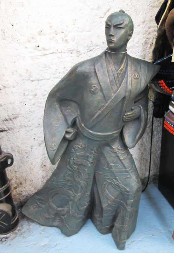 BRONZE SAMURAI, in a traditional Japanese costume adorned with dragons, 85cm H x 40cm x 44cm.