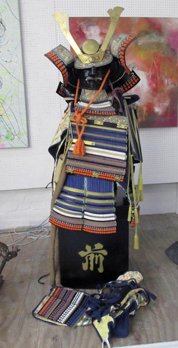 SAMURAI COSTUME, multicoloured protective armour and mask on stand with additional arm and leg