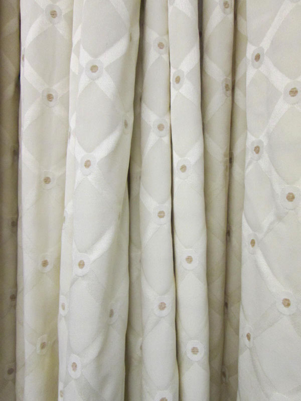 CURTAINS, a pair, cream fabric with geometric pattern lined and interlined, 170cm gathered x 225cm