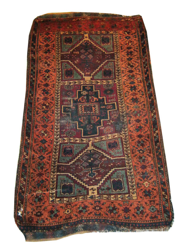 CAUCASIAN RUG, 202cm x 116cm, three stepped medallions surrounded and separated by an ivory calyx