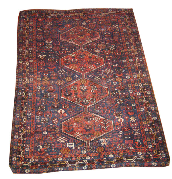 ANTIQUE KHAMSEH RUG, Persia circa 1900, 160cm x 118cm, row of medallions on sapphire field with