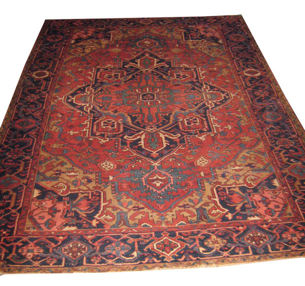 ANTIQUE HERIZ CARPET, 284cm x 184cm, circa 1910, the central medallion on a terracotta field