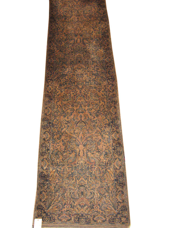 OLD KIRMAN RUNNER, 360cm x 90cm, the pale field decorated with turquoise, scrolling foliates