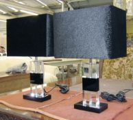 TABLE LAMPS, a pair, Art Deco style in black and clear cut crystal with an oblong black silk shade