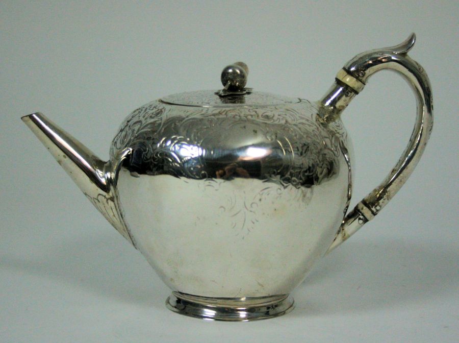 A William IV teapot Edinburgh 1836, of tapered apple form with chased band of decoration to rim,