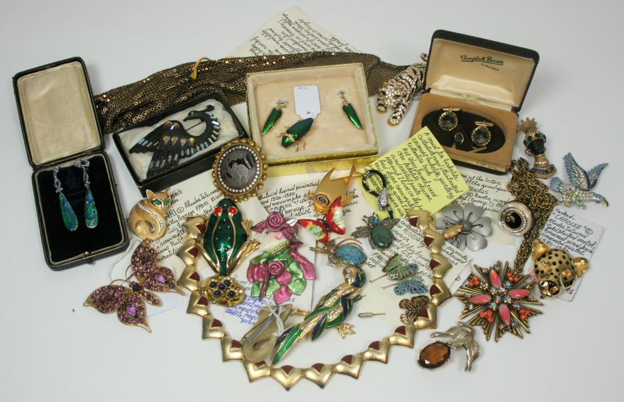 A collection of costume jewellery to include a blue bead and paste set necklace; green enamel beetle