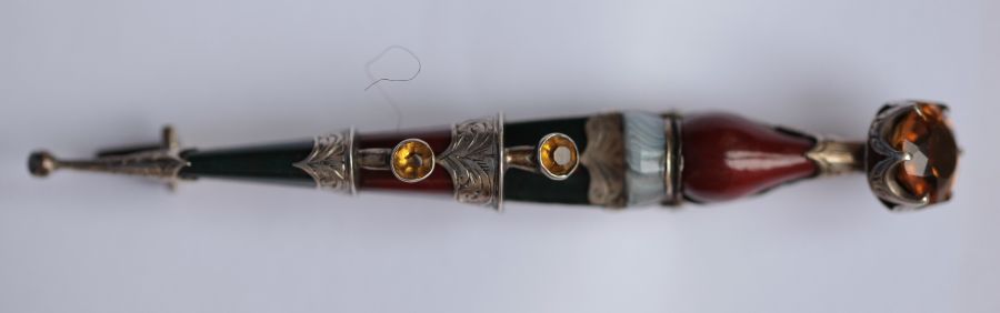 A Scottish hard stone kilt pin unmarked, modelled as a traditional Scottish dirk, set with