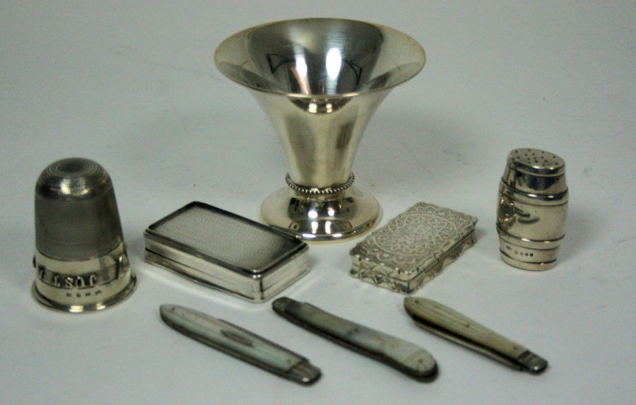 A collection of silver items to include two small snuff boxes; three mother of pearl mounted fruit