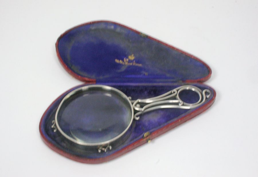 A presentation magnifying glass Alfred Clark, London 1900, of plain design with a scrolled open work