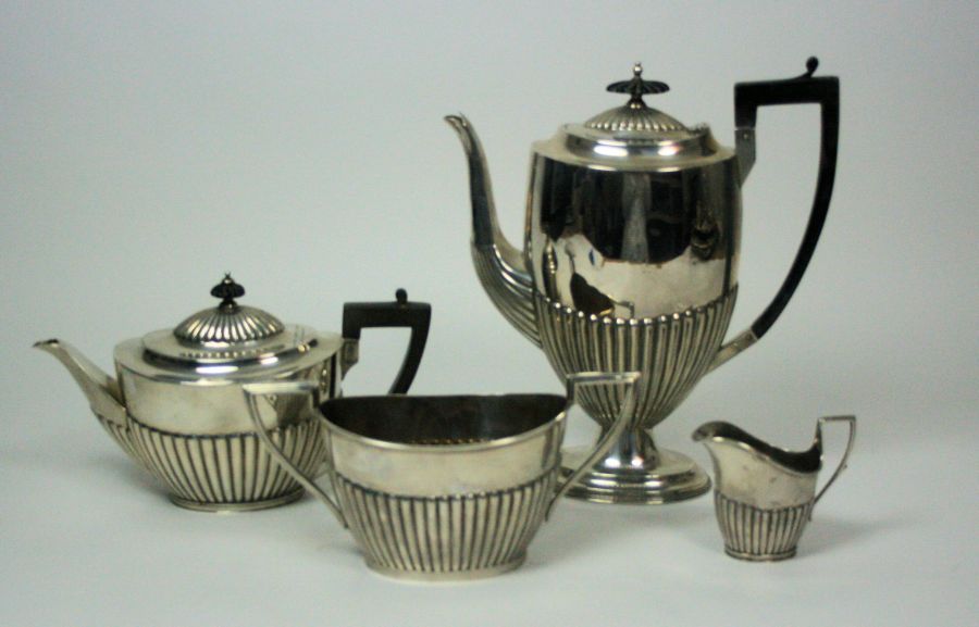 A matched Victorian and later four piece tea set various makers and dates comprising coffee pot,