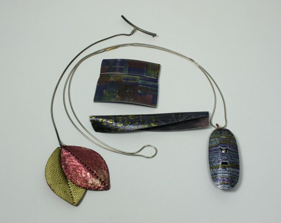 JANE ADAM - An anodised and digitally printed aluminum pendant of oval outline, with pierced