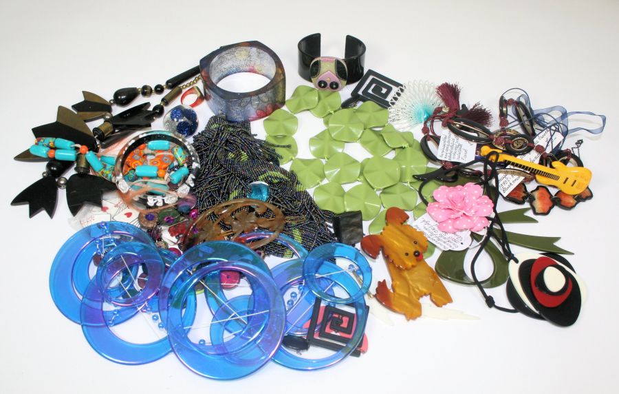A collection of plastic costume jewellery to include various bangles, necklaces, brooches and