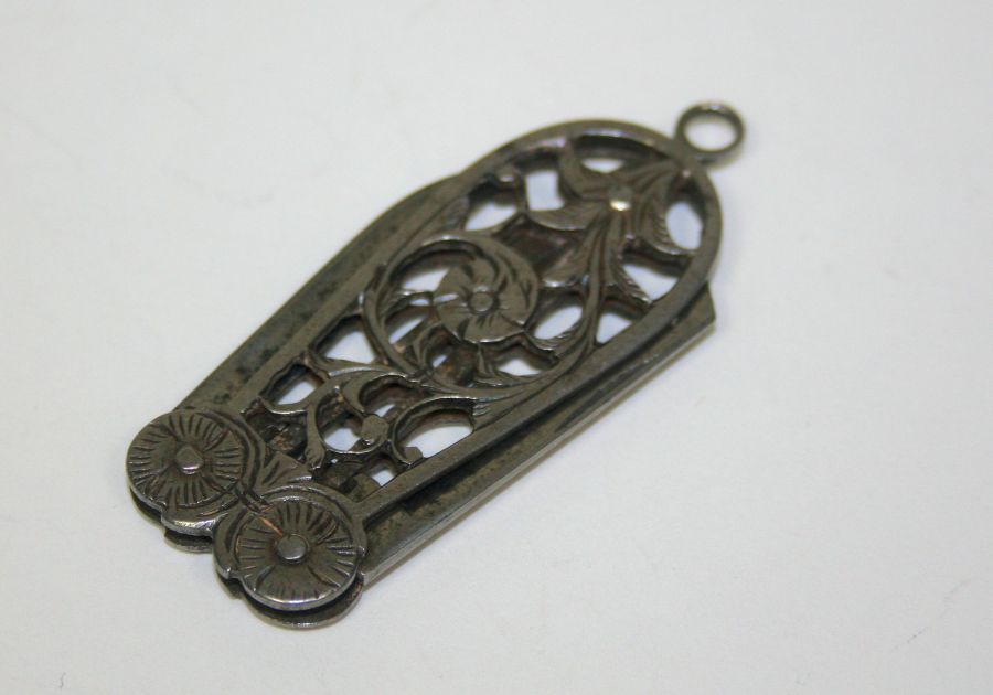 An 18th/early 19th century cut steel pendant pocket knife with pierced foliate decoration and hinged