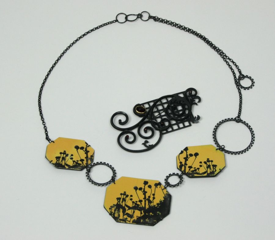 SALLY GRANT - `Rudbeckia` necklace composed of three oxidised white metal panels with floral black