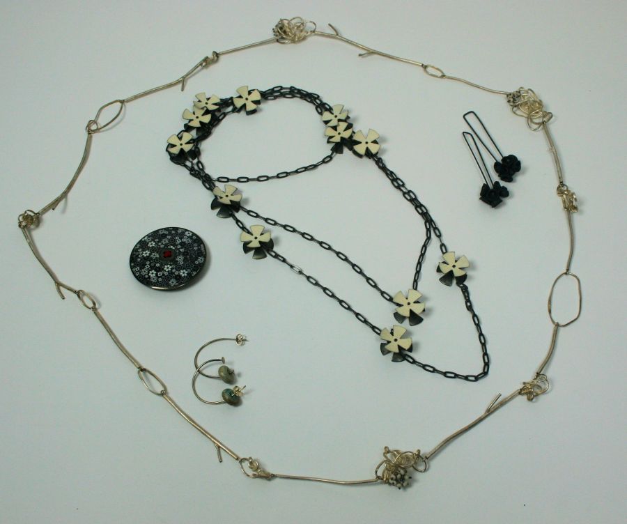 JANE MOORE - `Daisy chain necklace` composed of oxidised white metal links set at intervals with