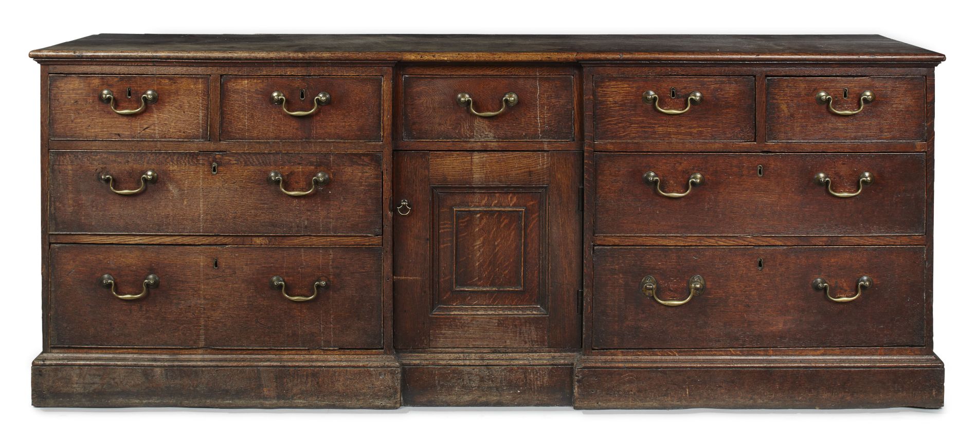 GEORGE III OAK DRESSER BASE CIRCA 1780 the rectangular top above an inverted breakfront fitted