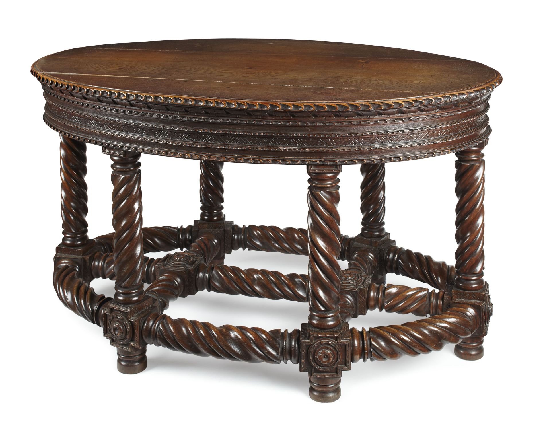 GOTHIC REVIVAL CARVED OAK CENTRE TABLE 19TH CENTURY the oval top with a thumbnail carved edge