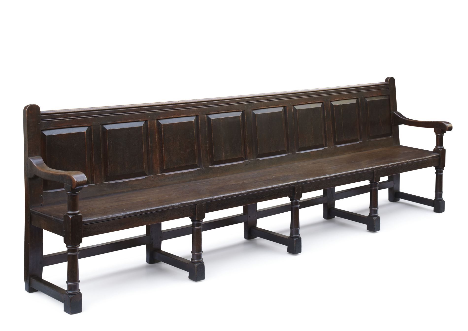 GEORGE III OAK HALL BENCH 18TH CENTURY the low rectangular back with eight panels and scroll arms