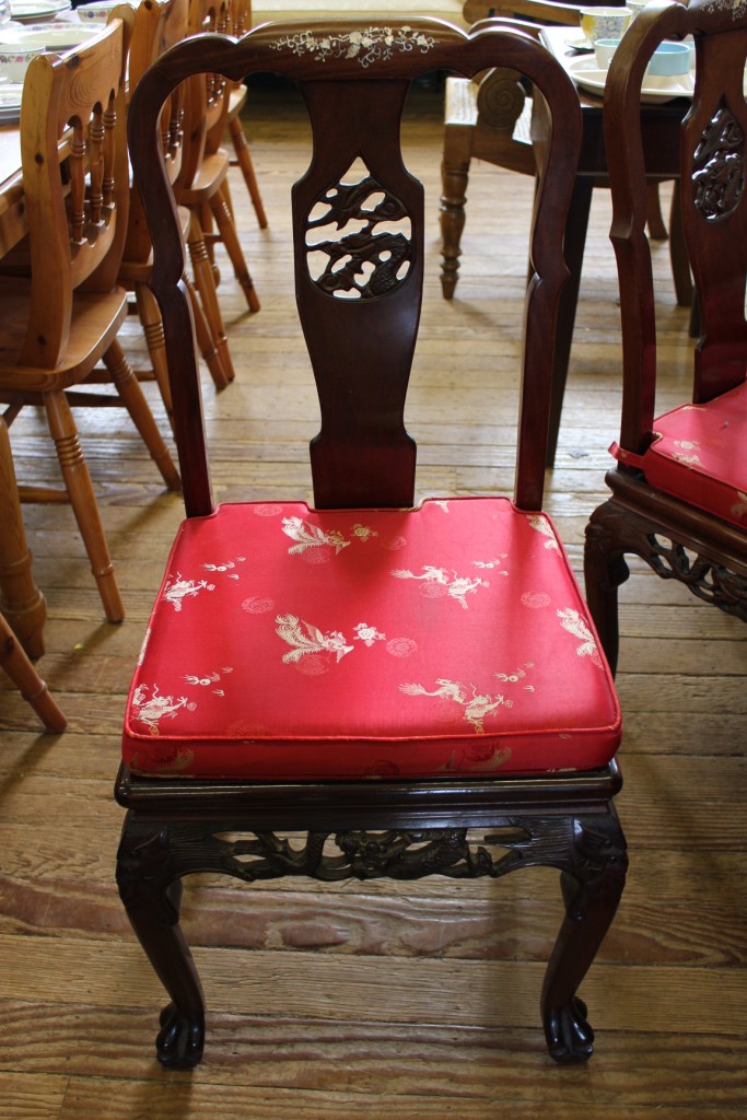 A set of eight Oriental style rosewood dining chairs with mother of pearl marquetry inlay to the top