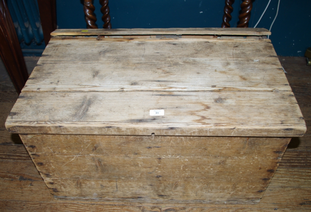 A 19th century oblong shaped pine storage box with lift up lid, as viewed