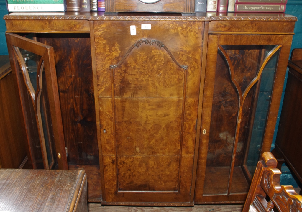 A late 19th century French style mahogany and walnut display cabinet with astragal doors, central