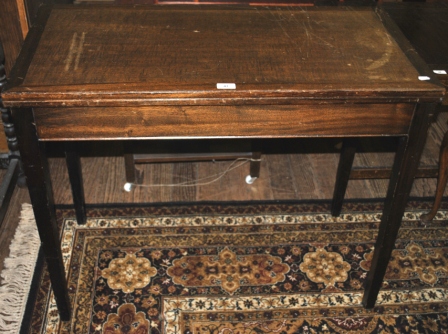 A mahogany and cross banded card table with base top supported on four square tapering legs