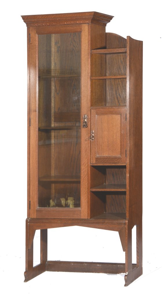 A SHAPLAND AND PETTER TALL OAK BOOKCASE with glazed cupboard, open shelves and a smaller cupboard