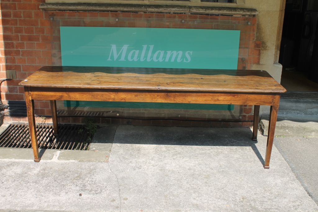 A 19TH CENTURY OAK AND ELM COUNTRY DINING/REFECTORY TABLE with plank top and one end drawer on