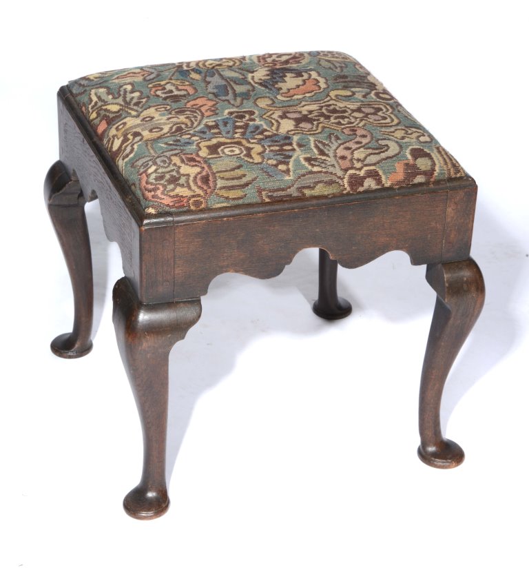 AN ANTIQUE OAK SQUARE DRESSING STOOL with tapestry top on cabriole legs, 46cm across