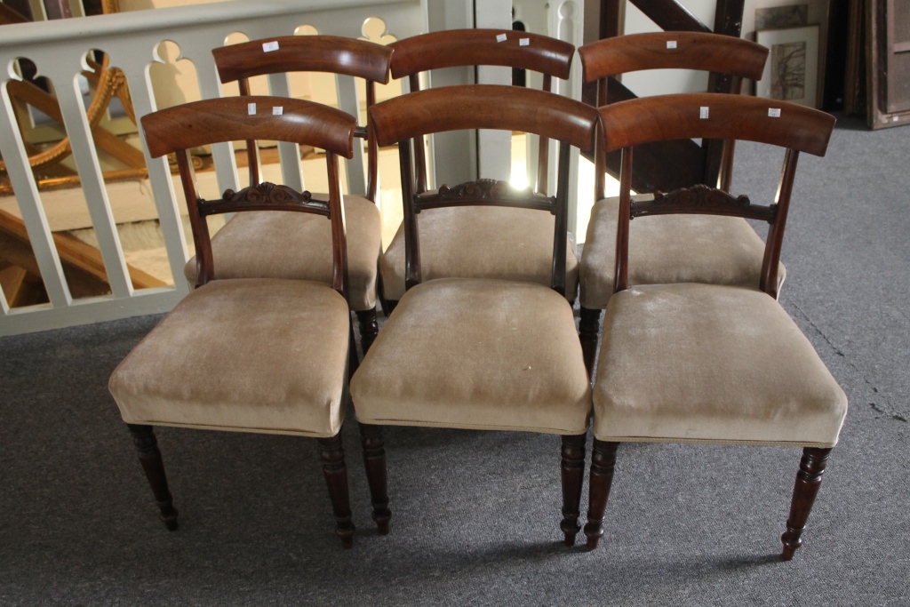 A SET OF SIX MID 19TH CENTURY MAHOGANY DINING CHAIRS, each with bar backs and upholstered seats on