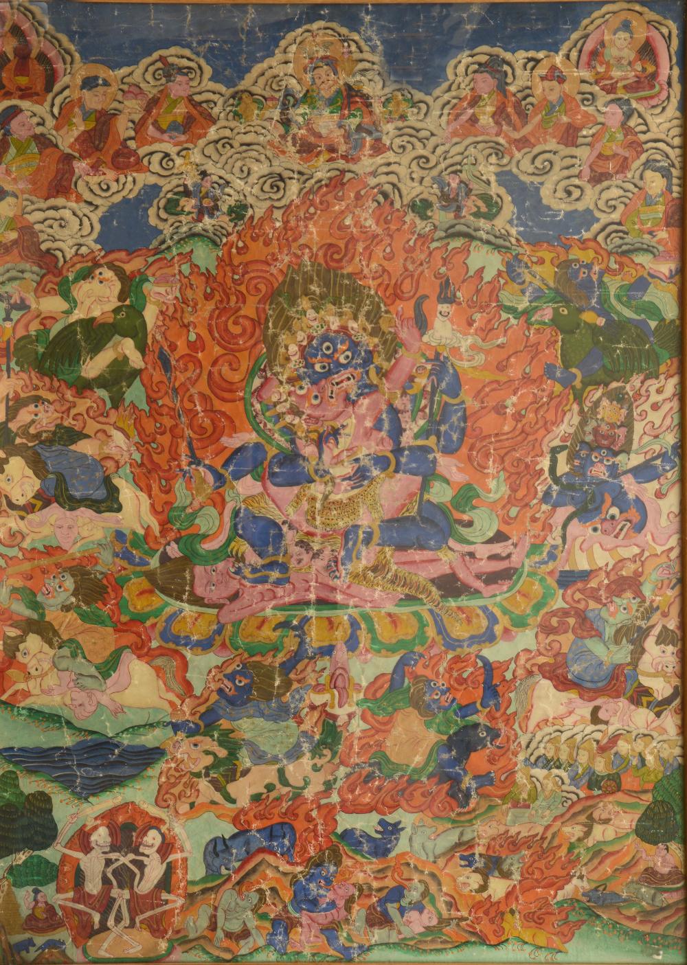 A TIBETAN THANGKA OF MAHAKALA in an tight embrace with consort, adorned with 8 skulls surrounded