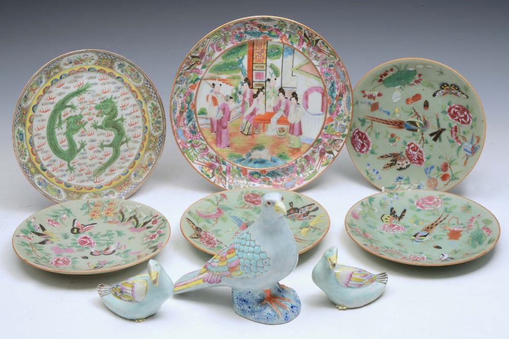 A CHINESE CANTON CIRCULAR PLATE, the central panel decorated with figures at a table, 10" (25.