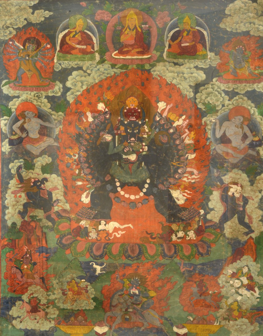 A THANGKA, depicting the wheel of life, with Yamantaka in the centre, with deities  surrounding