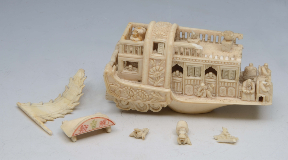 A CHINESE CANTON IVORY MODEL OF A HOUSEBOAT (with fragment pieces), 1900-1920, 3 1/2" (9cm).