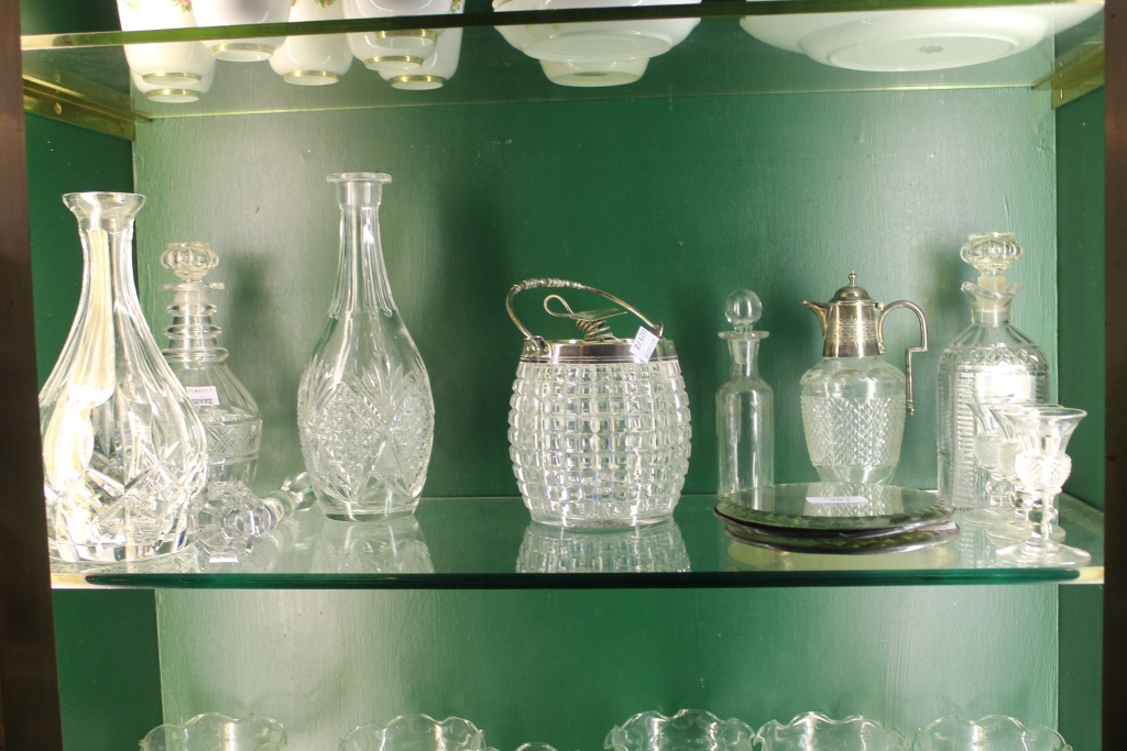 A VICTORIAN HOBNAIL CUT GLASS BISCUIT BARREL with silver plated cover, a small claret jug with